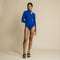 Blue, fitted, long sleeve bodysuit has cutaway detail on front.