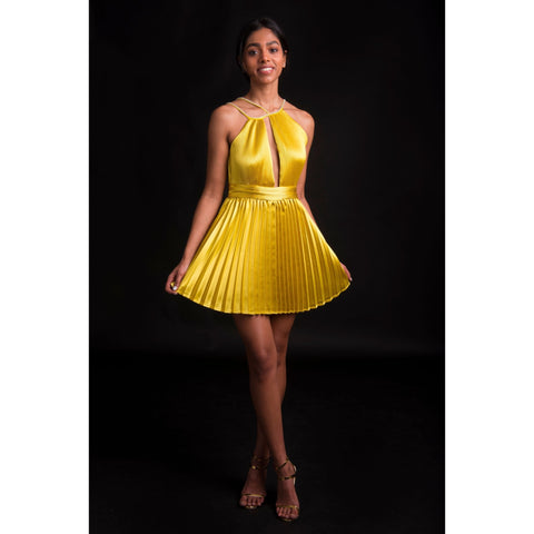 Golden Globe Dress with flowing pleated skirt and rhinestone neckline in editorial front pose