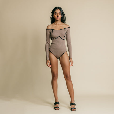 Brown, long sleeve, offshoulder bodysuit has contrasting draw detail on front.