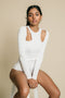 White, twist front, long sleeve shirt.